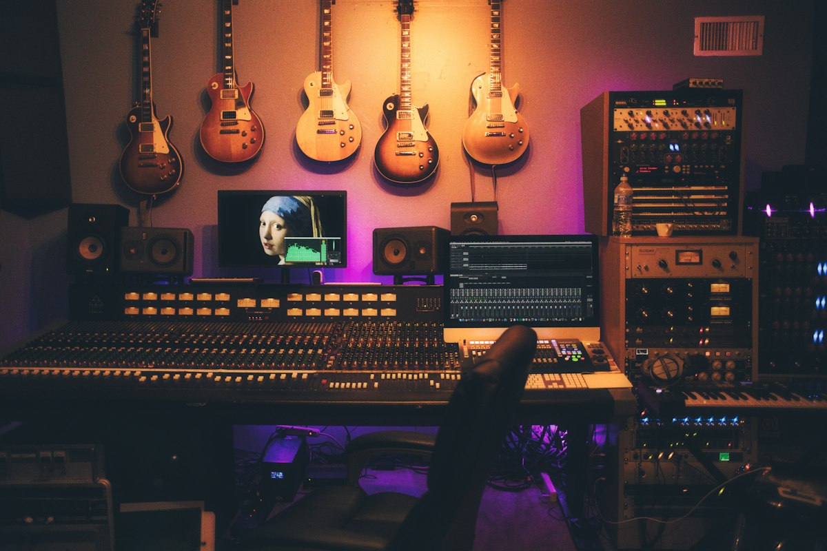 A recording studio audio console representing digital media.